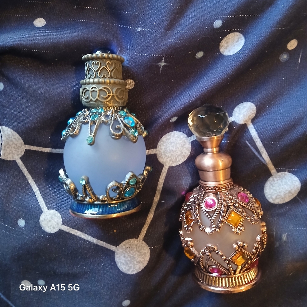 Decorative Glass Perfume Bottles with Jewel Accents.